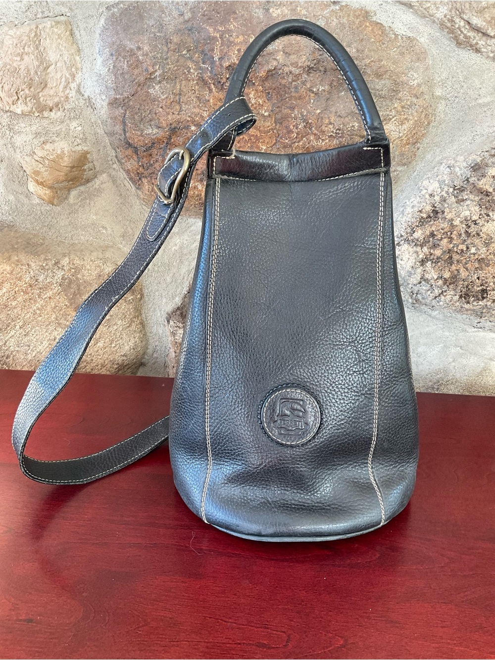 Leather Bucket Shoulder Bag in Black - Classic Embossed Logo